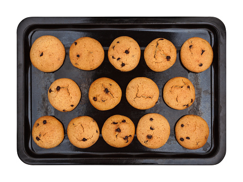 Old baking tray with homemade peanut cookies on white background, top view