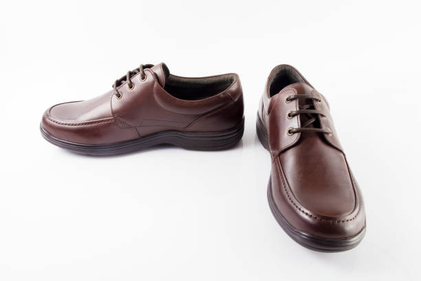 istock Male brown leather shoe on white background 864499198
