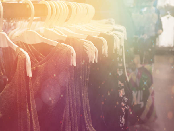 istock colored clothes on hangers, blurry, flare 864500340