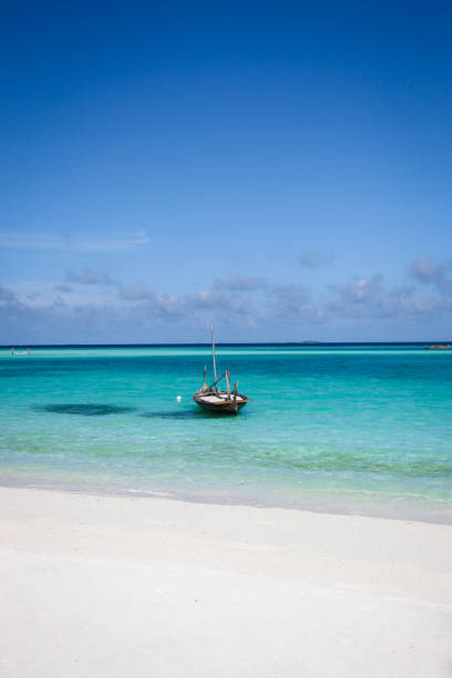 istock Traditional boat floating in lagoon 864500356