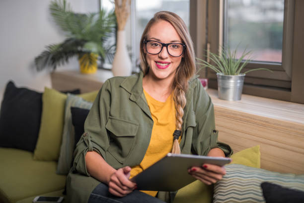 istock Young woman with digital tablet 864500516