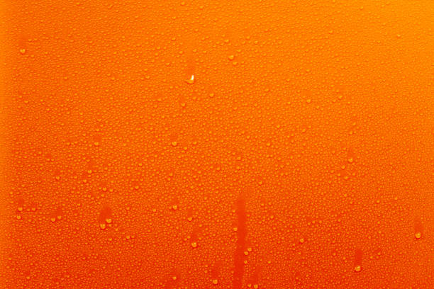 istock Water Drops On Orange Background Texture colorful waterdrop small 864501468
