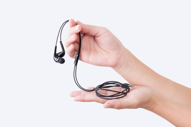 istock A woman hand holding earphones 864501792