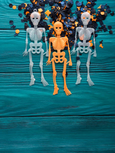 istock Halloween party decorations skeleton on dark green 864503340