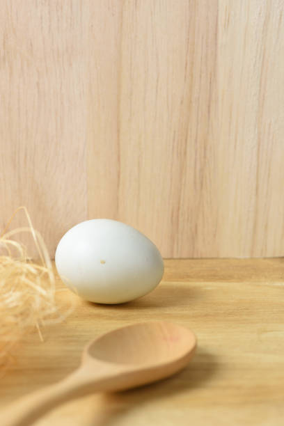 istock Fresh egg on a Brown wooden background 864503346
