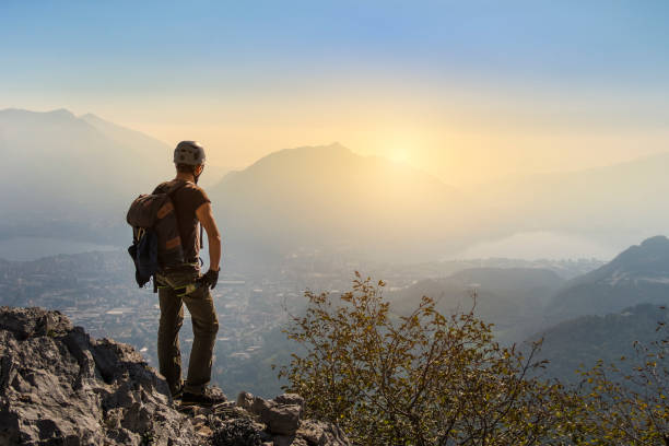 istock Climber on top of the mountain at sunset 864507422