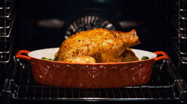 Chicken in an oven. stock photo