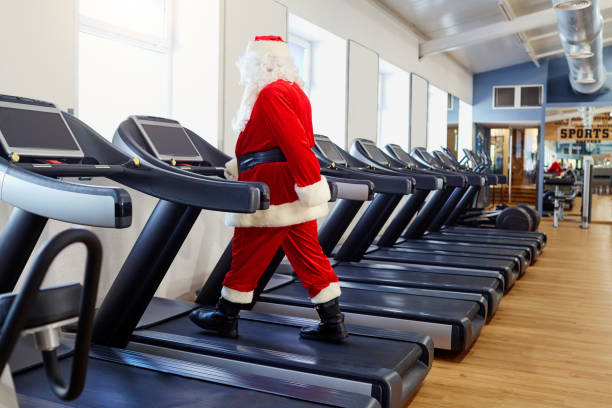 istock Santa Claus in the gym doing exercises 864508448