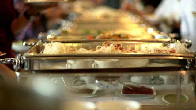 People group catering buffet food indoor in the restaurant.