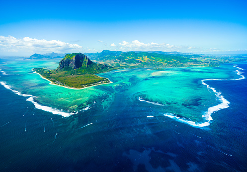 Aerial view of Mauritius island panorama and famous  Le Morne Brabant mountain, beautiful blue lagoon and underwater waterfall