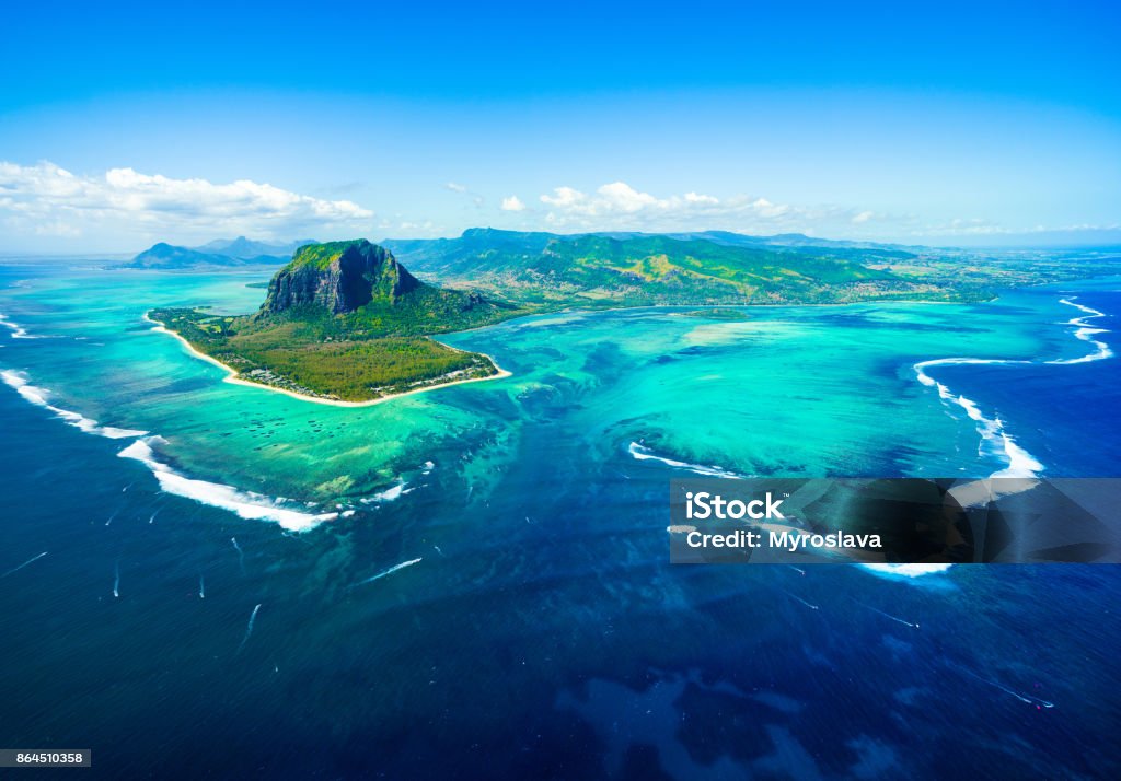 Aerial view of Mauritius island Aerial view of Mauritius island panorama and famous  Le Morne Brabant mountain, beautiful blue lagoon and underwater waterfall Mauritius Stock Photo