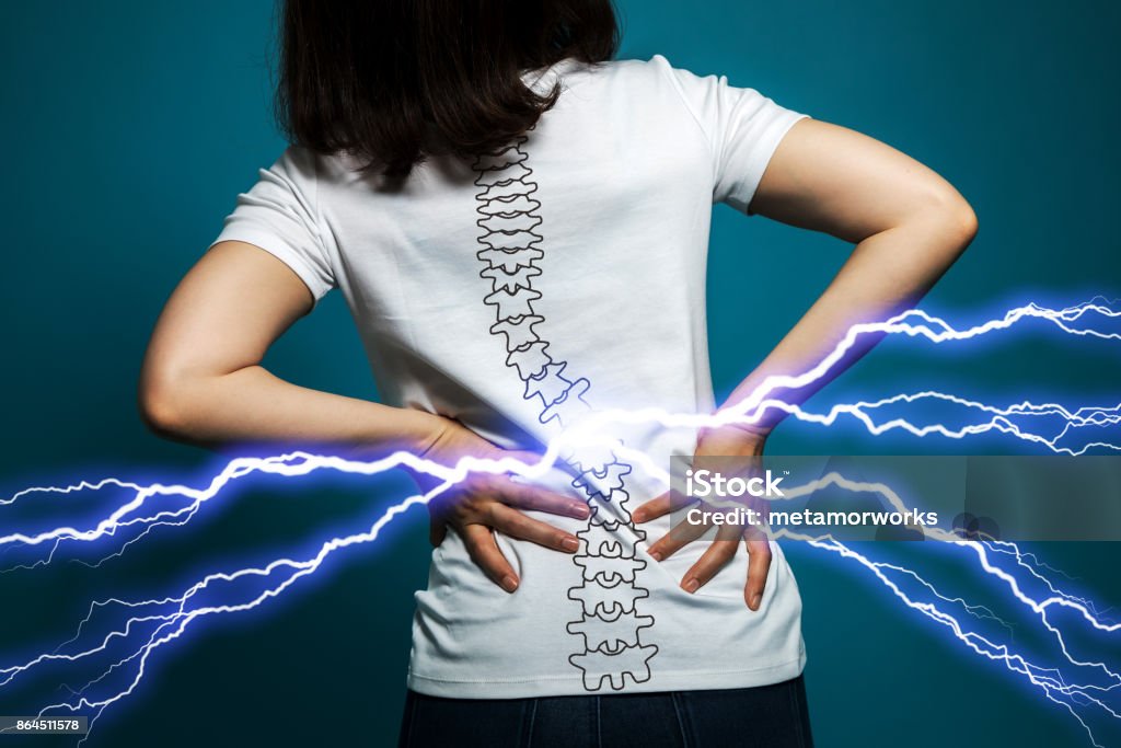 young woman who has backache. Herniated Disc Stock Photo