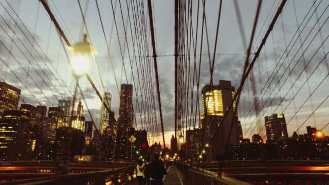 Bicycle POV: night ride on the Brooklyn Bridge, NY city
