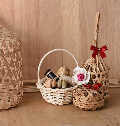 Thai traditional dessert in wicker bamboo basket On wood background.