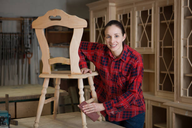 istock Carpenter  woman doing his job in carpentry workshop. 864521562