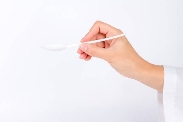 istock hand of nurse doctor stretches empty spoon 864523196