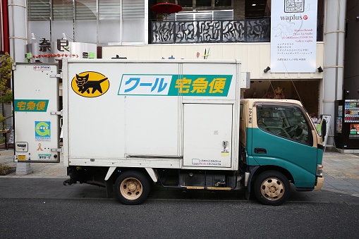 Nara: Yamato Transport delivery van in Tokyo, Japan. Yamato is the largest door-to-door delivery service company in Japan with more than 40 percent market share.