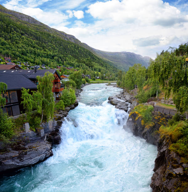 Prestfossen waterfall on the river Bøvra in Lom, Norway. Composite photo
