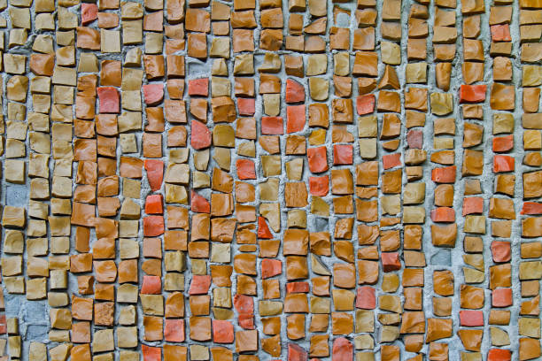 istock Beige old stone mosaic tiles on the wall 864525894