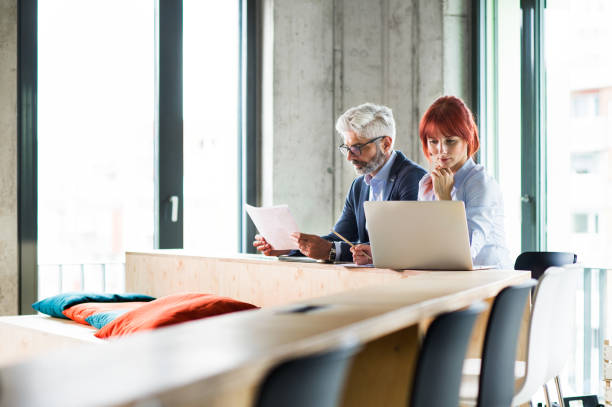 istock Business people in the office consulting a project. 864526412