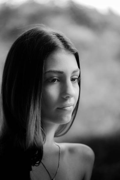 istock Beautiful Young Lady Monochrome Portrait with Strong Shadows 864527578