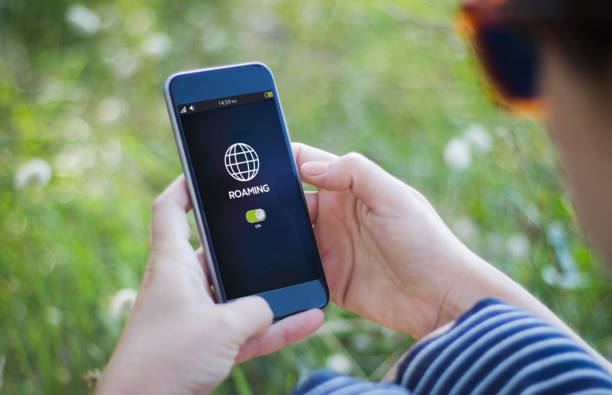 istock woman checking roaming on her smartphone 864528006