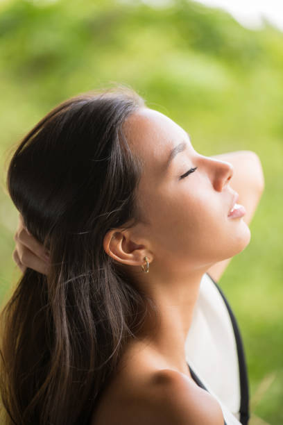 istock Beautiful Young Lady Profile Portrait Eyes Closed 864528240