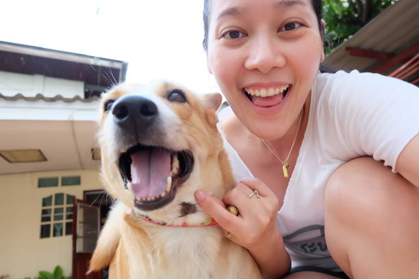 Asian woman selfie with dog