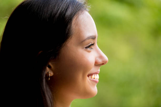 istock Beautiful Young Lady Profile Portrait Smiling 864528678