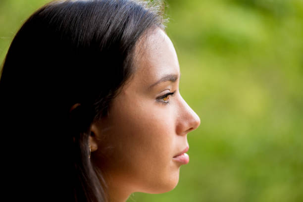 istock Beautiful Young Lady Profile Portrait Serious 864528932