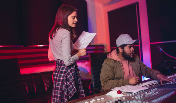 istock Sound engineers working in music recording studio 864529694