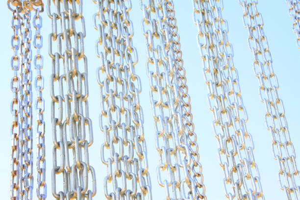 istock Stainless steel chains on blue sky background, in a market 864533600
