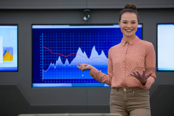 istock Portrait of female executive giving presentation on graph 864534412