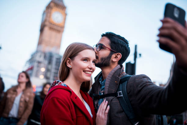 istock Young couple taking a selfie in front of Big Ben 864535818