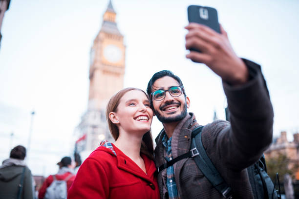 istock Young couple taking a selfie in front of Big Ben 864535866