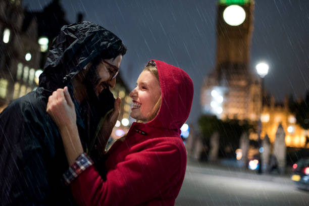 istock Young couple in rainy London 864536032