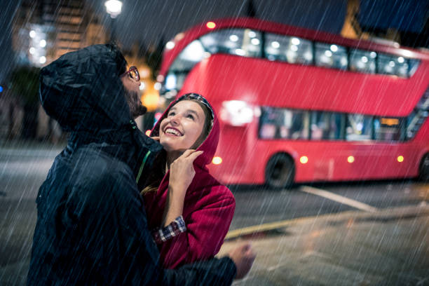 istock Young couple in rainy London 864536054