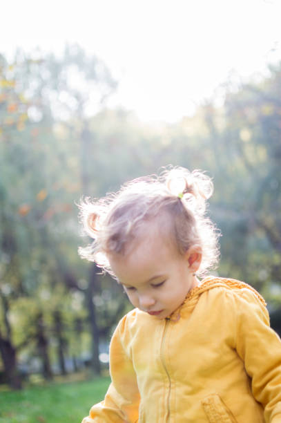istock Little girl in autumn park 864536334