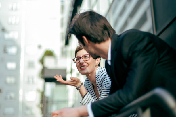 istock Two business people in front of office 864537330