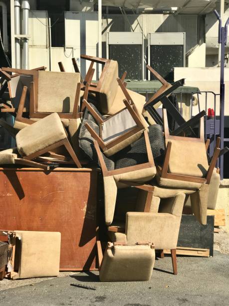 istock Discarded wood chairs in street 864540500