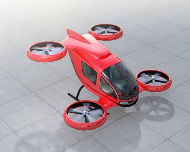 Metallic red self-driving passenger drone parking on the ground Metallic red self-driving passenger drone parking on the ground. 3D rendering image upward mobility stock pictures, royalty-free photos & images