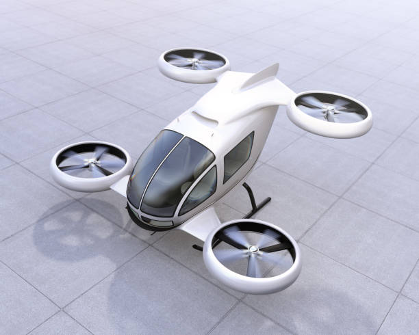 White self-driving passenger drone landing on the ground White self-driving passenger drone landing on the ground. 3D rendering image. upward mobility stock pictures, royalty-free photos & images