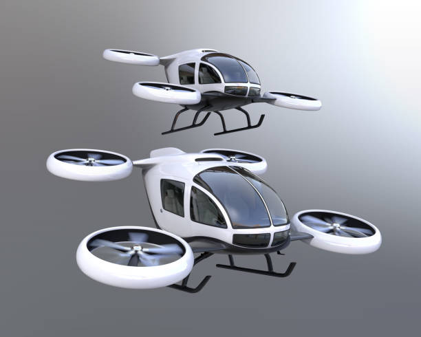 Two self-driving passenger drones flying in the sky Two self-driving passenger drones flying in the sky. 3D rendering image. tilt rotor stock pictures, royalty-free photos & images