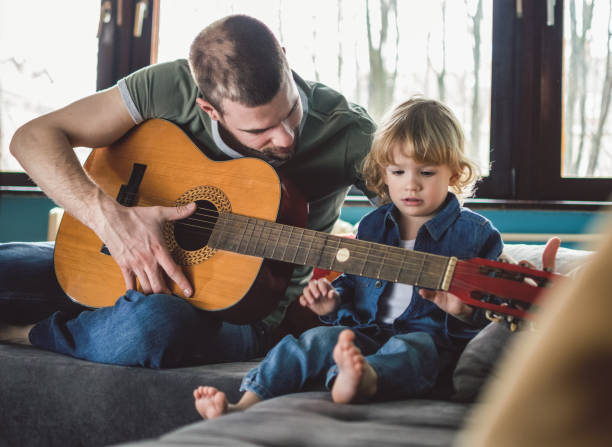 istock Playing song on a guitar 864548942