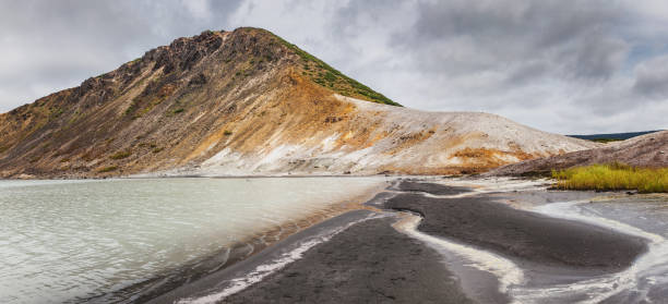 The lake in the caldera of Golovnin volcano, Kunashir island, Russia Golovnin is a caldera located in the southern part of Kunashir Island, Kuril Islands, Russia. It is the southernmost volcano of the Kuril Islands. kunashir island stock pictures, royalty-free photos & images