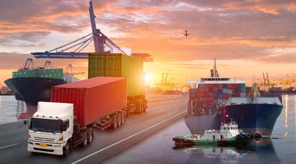 istock Logistics and transportation of Container Cargo ship and Cargo plane with working crane bridge in shipyard at sunrise, logistic import export and transport industry background 864554474