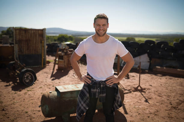 istock Man standing with arms crossed on a sunny day 864556804