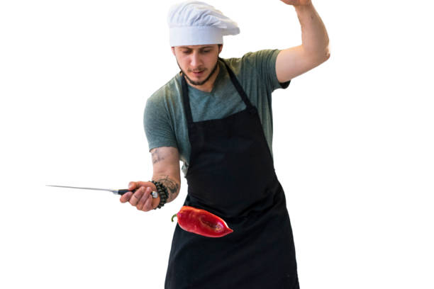 Chef about to cut a flying bell pepper
