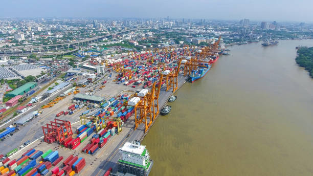 istock Logistics and transportation of Container Cargo ship and Cargo working crane bridge in shipyard 864557424