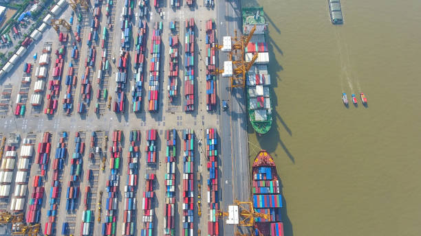 istock Logistics and transportation of Container Cargo ship and Cargo working crane bridge in shipyard 864557580